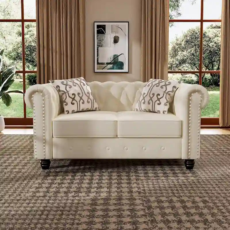 Causeuse en velours capitonnée avec clous décoratifs