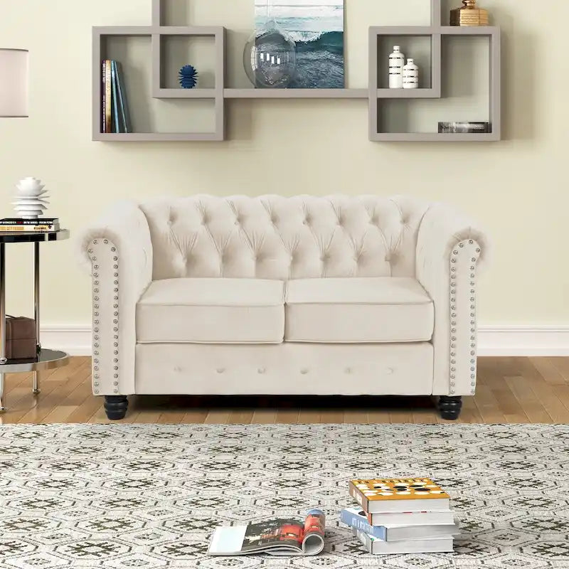 Causeuse en velours capitonnée avec clous décoratifs
