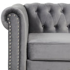 Causeuse en velours capitonnée avec clous décoratifs