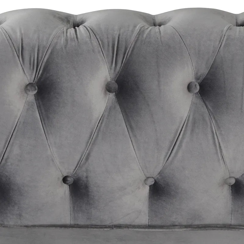 Causeuse en velours capitonnée avec clous décoratifs